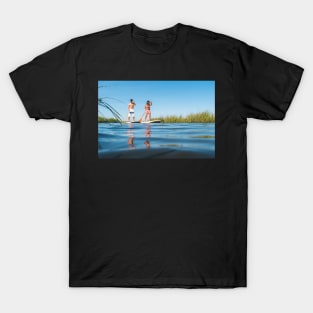 Man and woman stand up paddleboarding T-Shirt